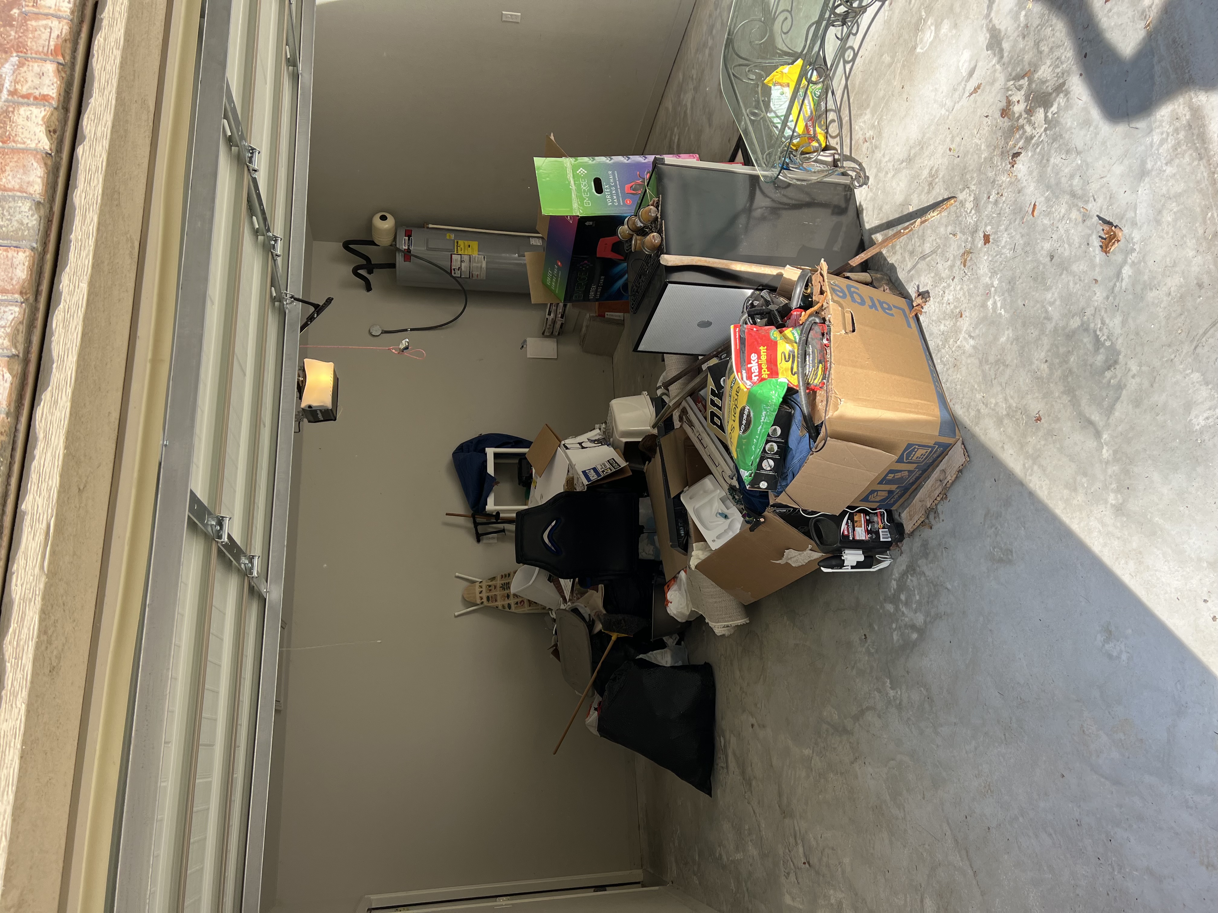 Garage Before - with Lawn Junk